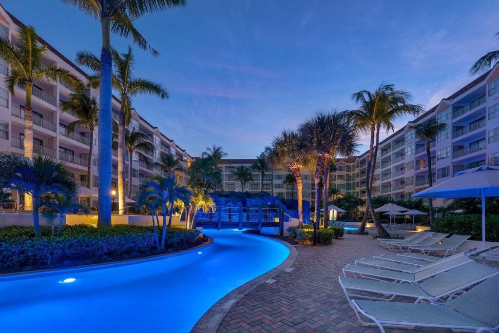 curved lighted resort pool at night