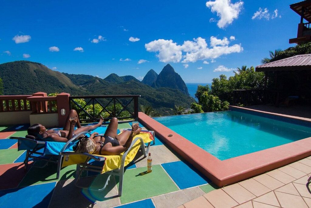 couple lounging next to pool