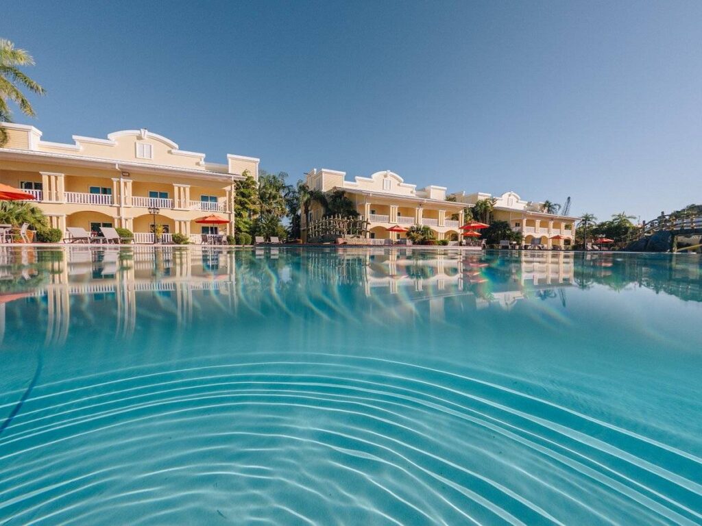 massive pool with resort in background