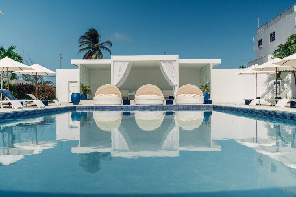 resort pool with lounge beds