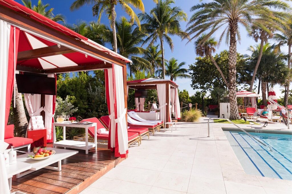 Faena Hotel Miami Beach red cabanas next to pool