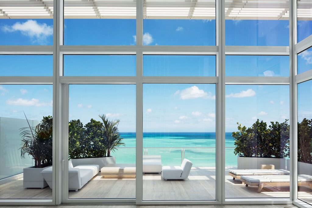 Four Seasons Hotel at The Surf Club private patio with white chairs