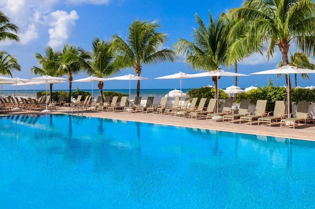 Southernmost Beach Resort large resort pool with lounge chairs and palm trees