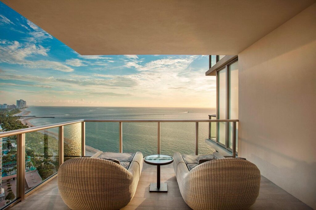 St. Regis Bal Harbour Resort covered patio with chairs looking out over ocean