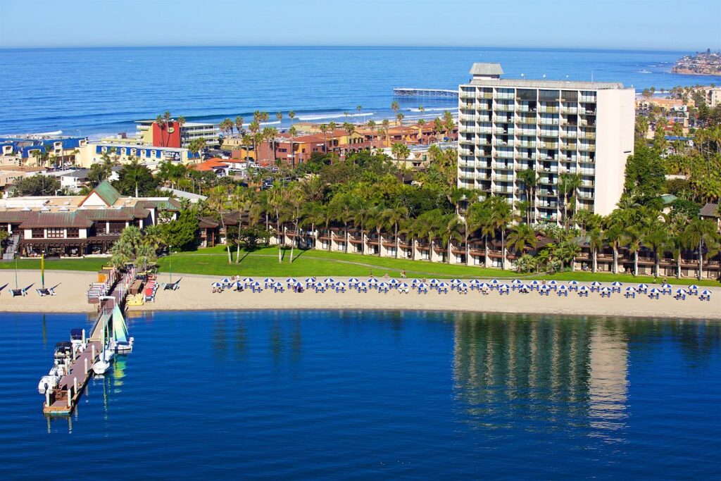 aerial view of pier and hotel along waterfront