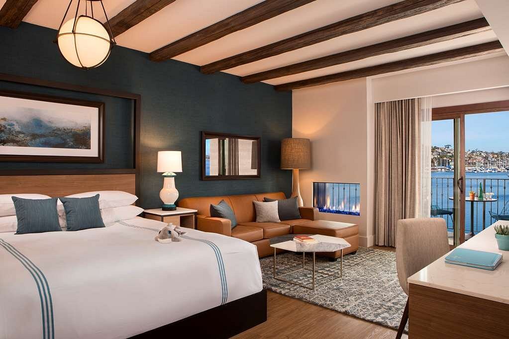 resort room with green wall and wood beams on ceiling