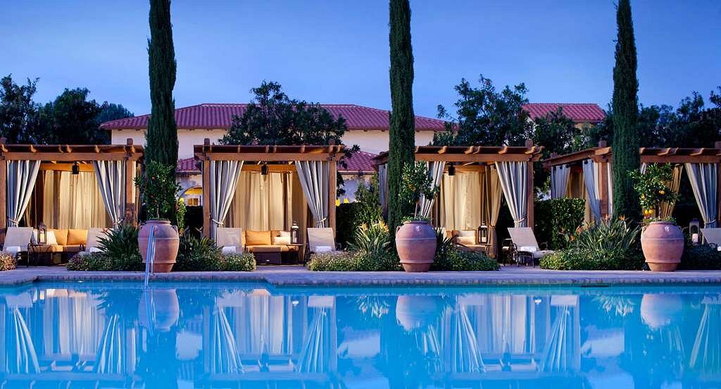 row of private cabanas along pool