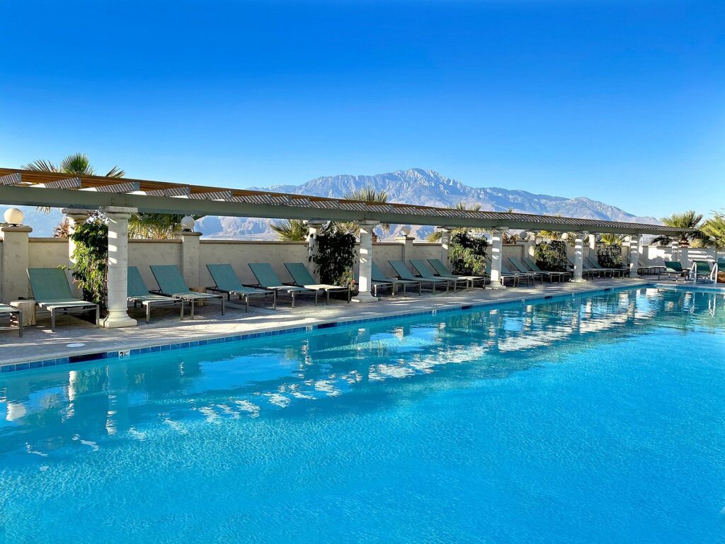 large resort pool with mountain in the background