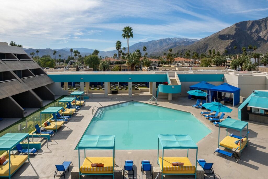 large resort pool area with mountains in the background