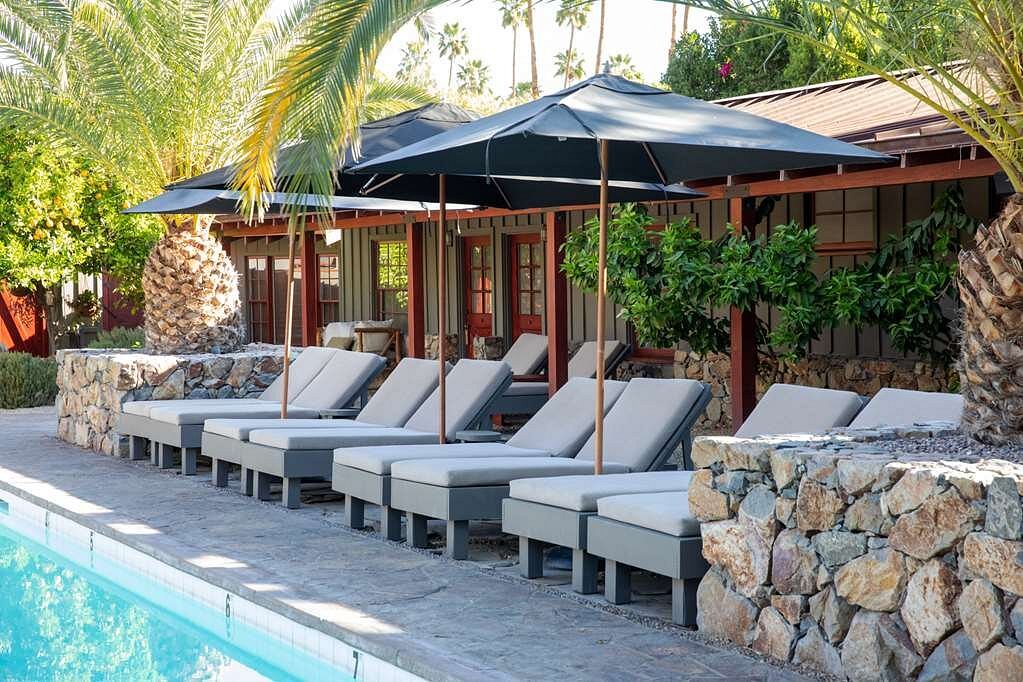 lounge chairs under private resort cabanas